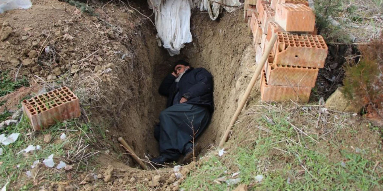 Ölmeden kendi mezarını kazdı, içinde yatıyor